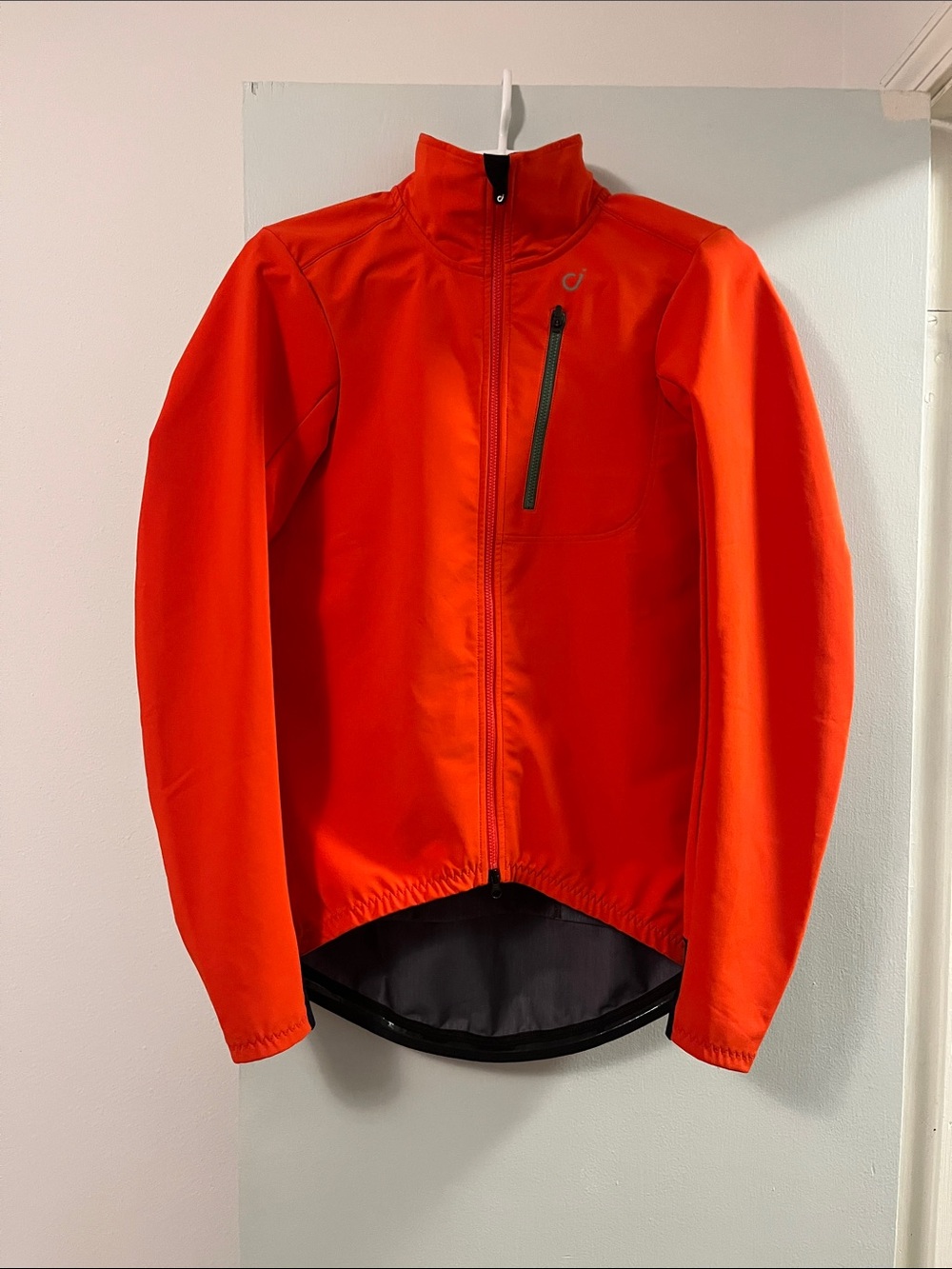 Velocio Men's Softshell cycling Jacket. Chest pocket and 3 deep back pockets.
